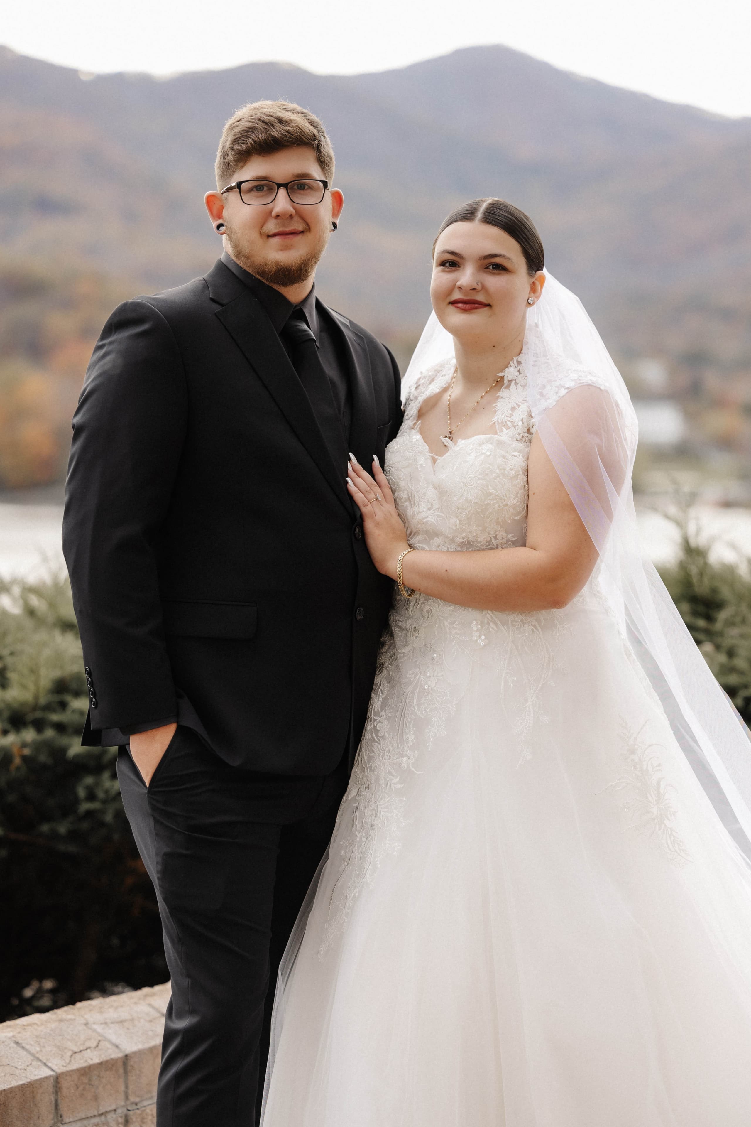 Couple portrait with mountain backdrop and fall foliage