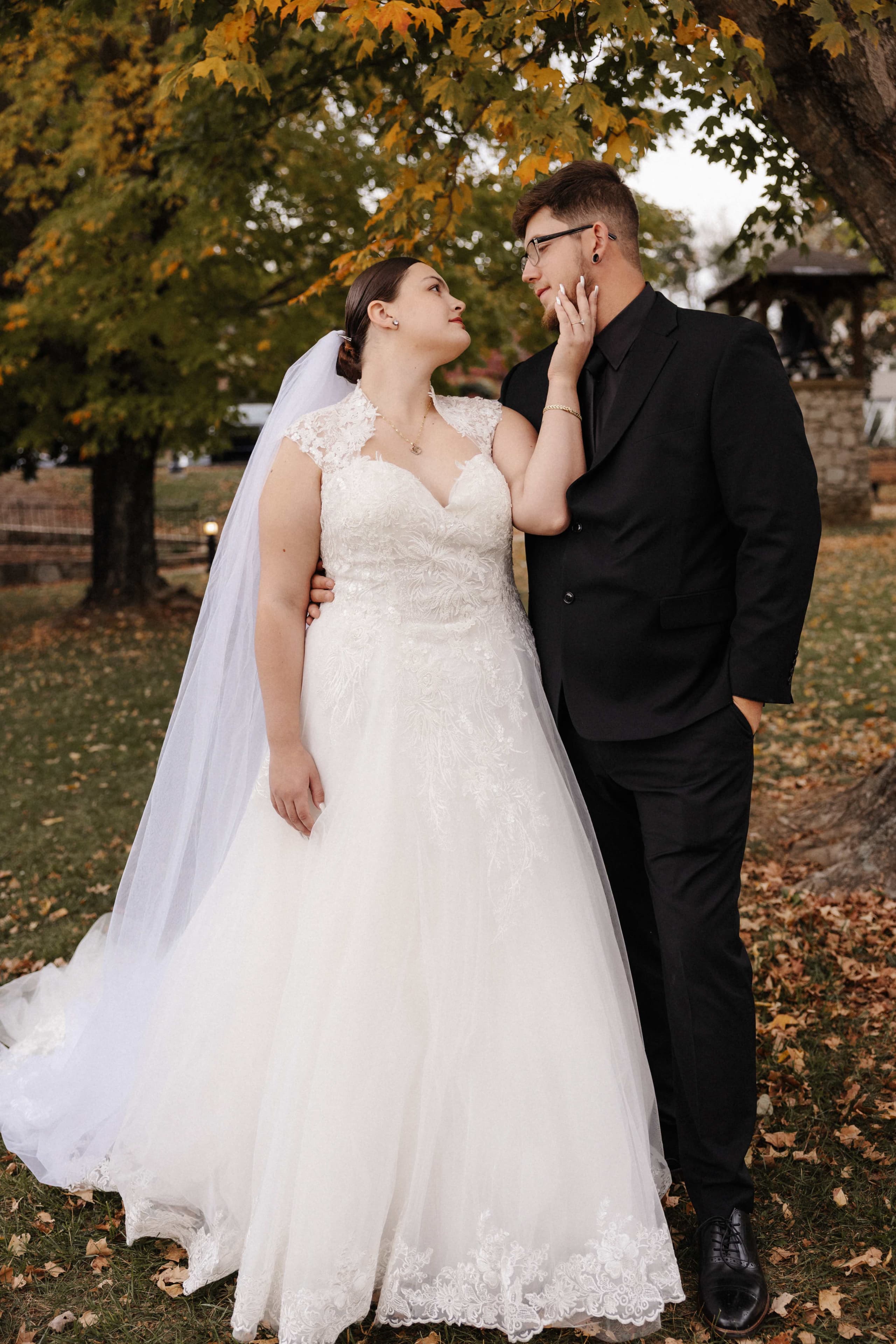 Romantic couple portrait with bride touching groom's face